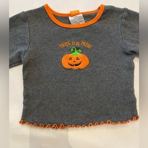 Trick or Treat with happy pumpkin long sleeved Tshirt. Scalloped in orange